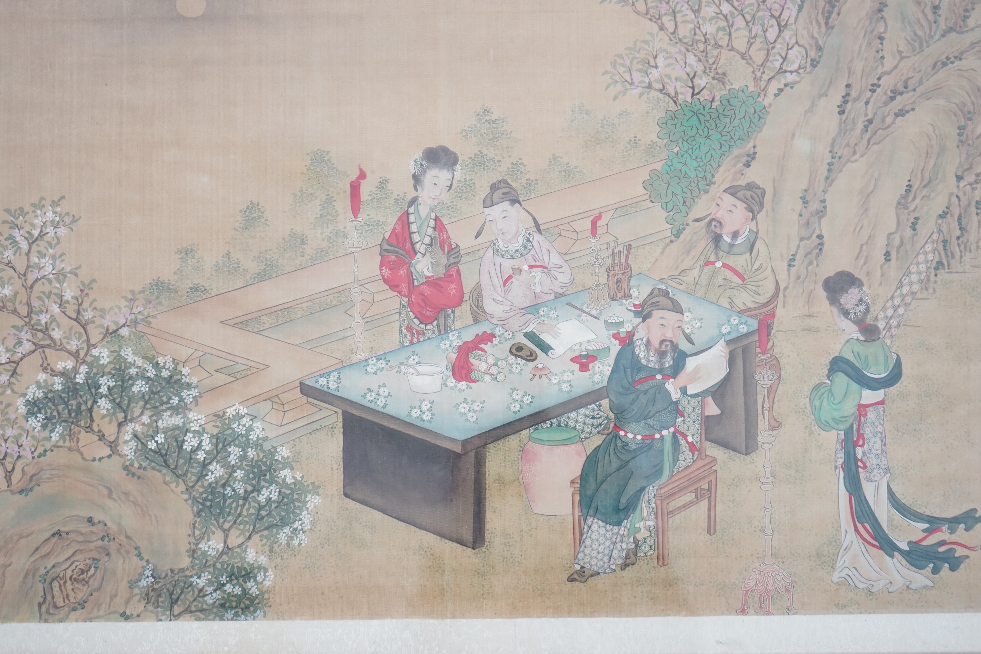 Chinese School, late 19th century, painting on silk, Scholars and attendants in a garden, 35cm x 58cm, framed and glazed. Condition - fair, some general discolouration